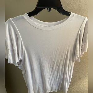 White crop with ruffled shoulders
